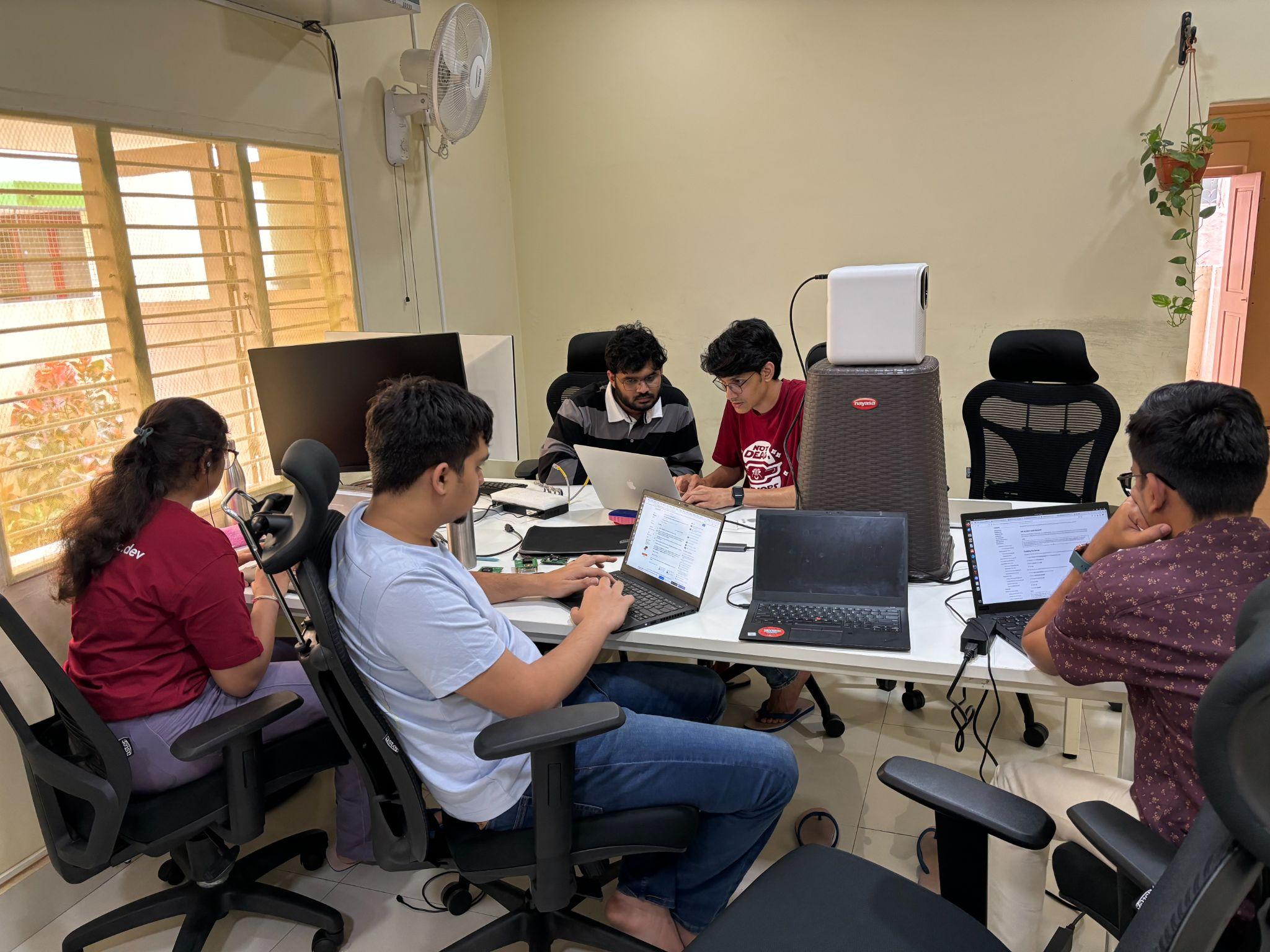 People working on computers at a desk