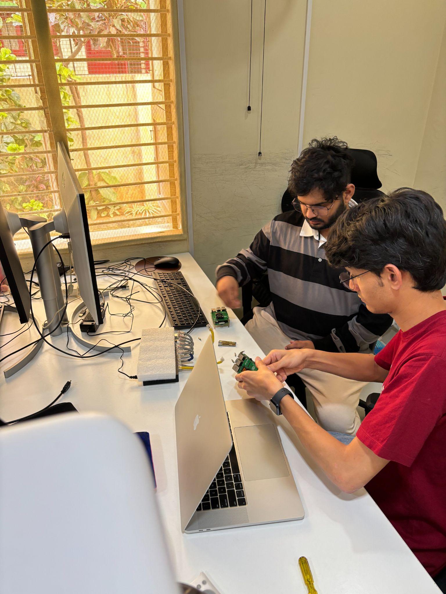 Two engineers working at a desk