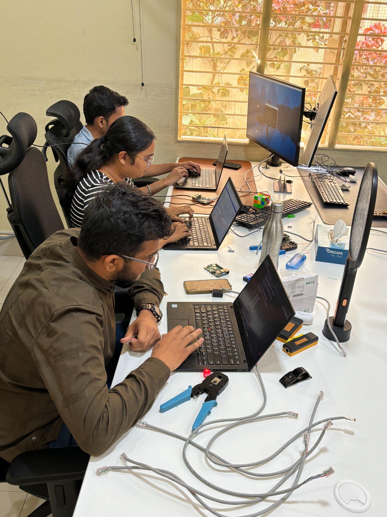 Engineers working together on computers